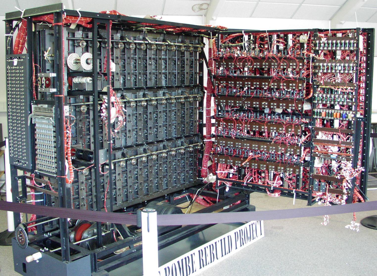 A working replica of a bombe machine, partially disassembled for display